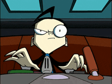 A 12-year-old boy with a large forehead and black hair styled in a pronounced spike, round glasses, a black trenchcoat, and a mucky yellow-green shirt with a blank face graphic. He's reaching for something offscreen with a focused look on his face, and his tongue is sticking out.